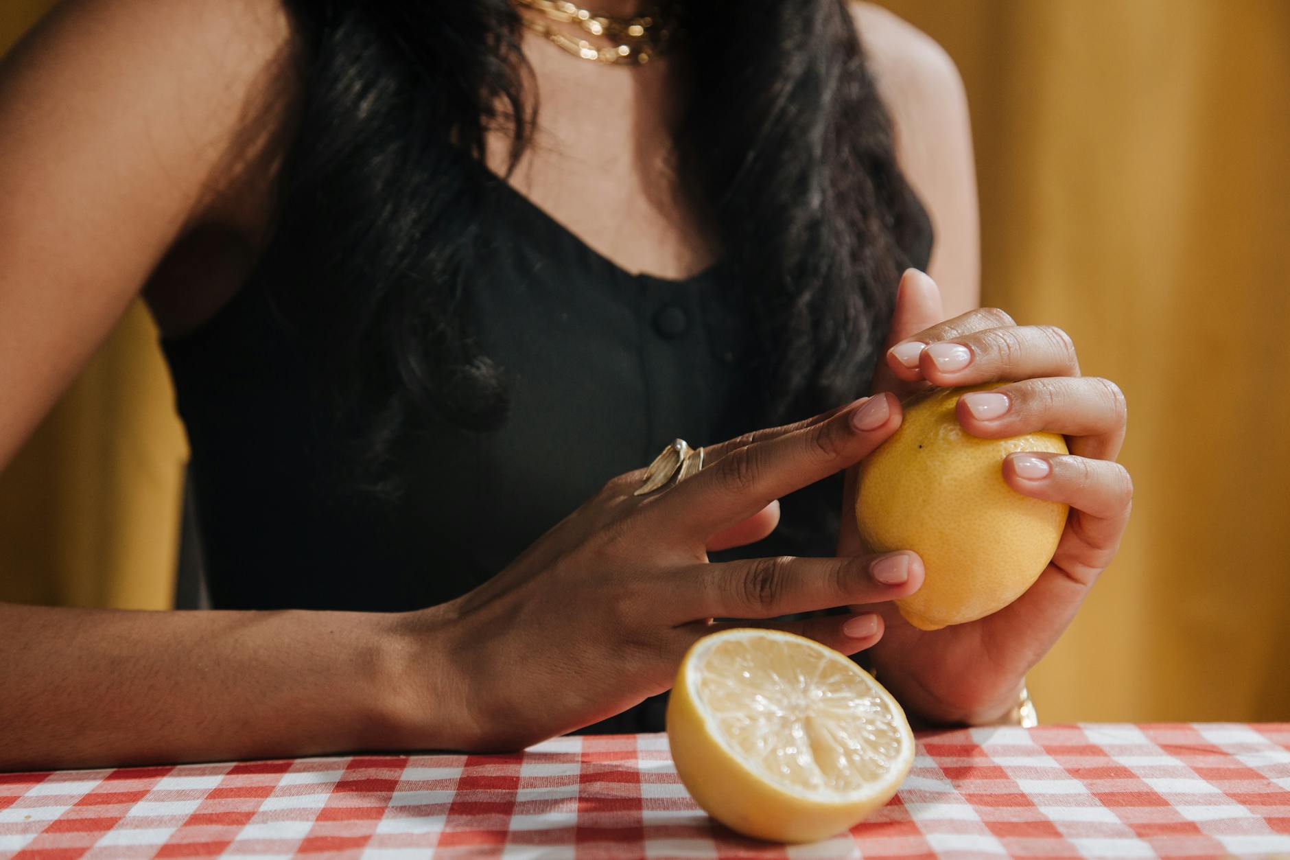 Woman holding blue and pink silicone vibrators in contemplative pose, representing intimate wellness during medication adjustment